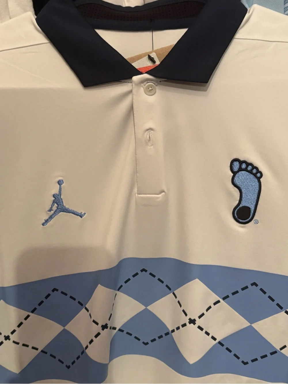 Jordan White UNC Polo with Light Blue Argyle Chest and Navy Trim